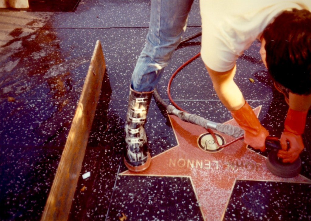 Polishing John Lennon's star.